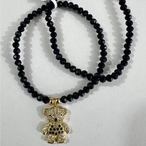Elegant Black Beaded Bracelet with Gold Teddy Bear Charm